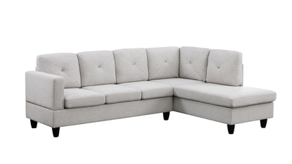 The Santiago - Linen Sectional Sofa With Right Facing Chaise features a light gray L-shape, tufted back cushions, three seat cushions, a right-side chaise lounge, and short black legs.