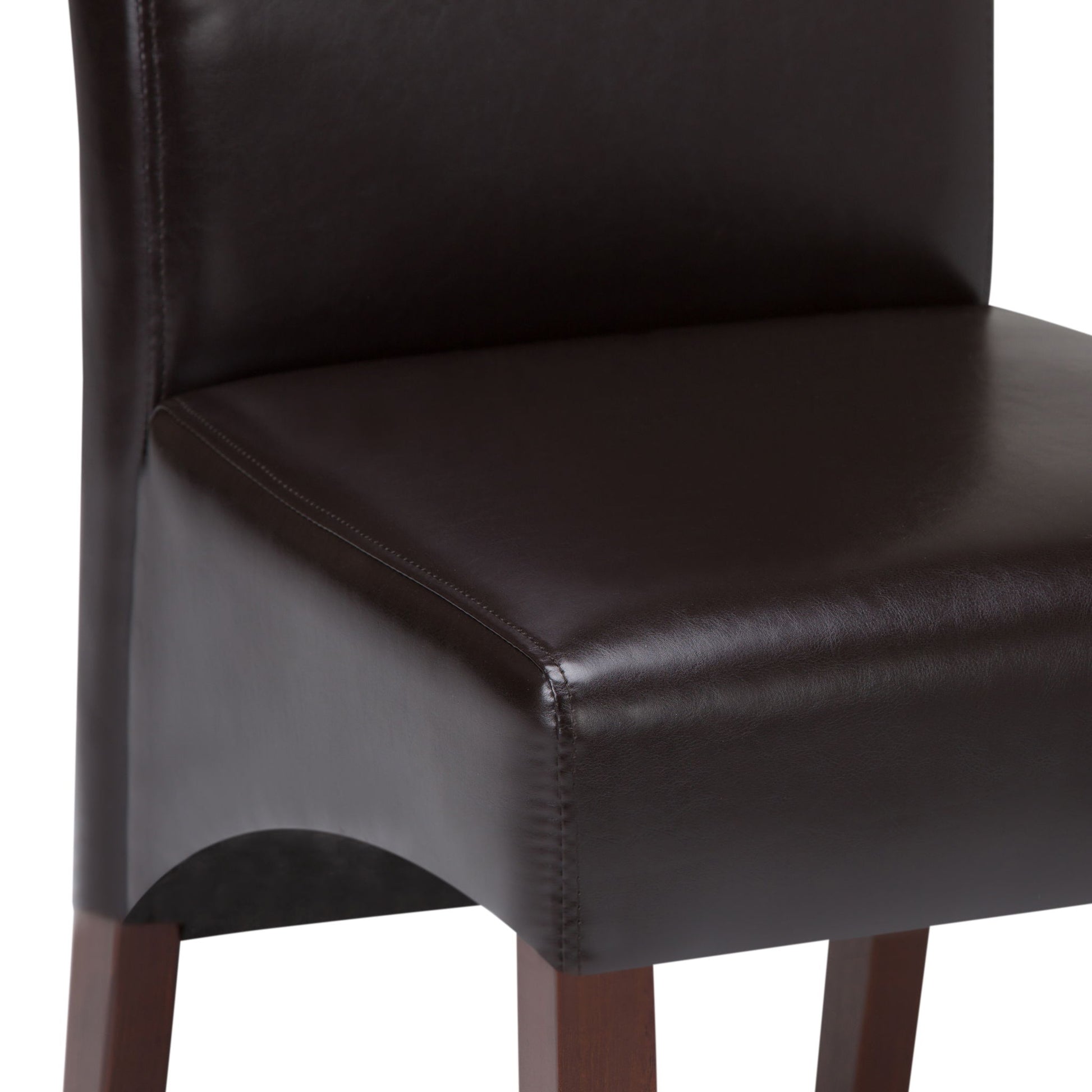 Close-up of the Avalon - Deluxe Parson Dining Chair (Set of 2) with a dark brown leather seat and backrest, visible stitching, and wooden legs. Image highlights part of the seat, backrest, and two legs.