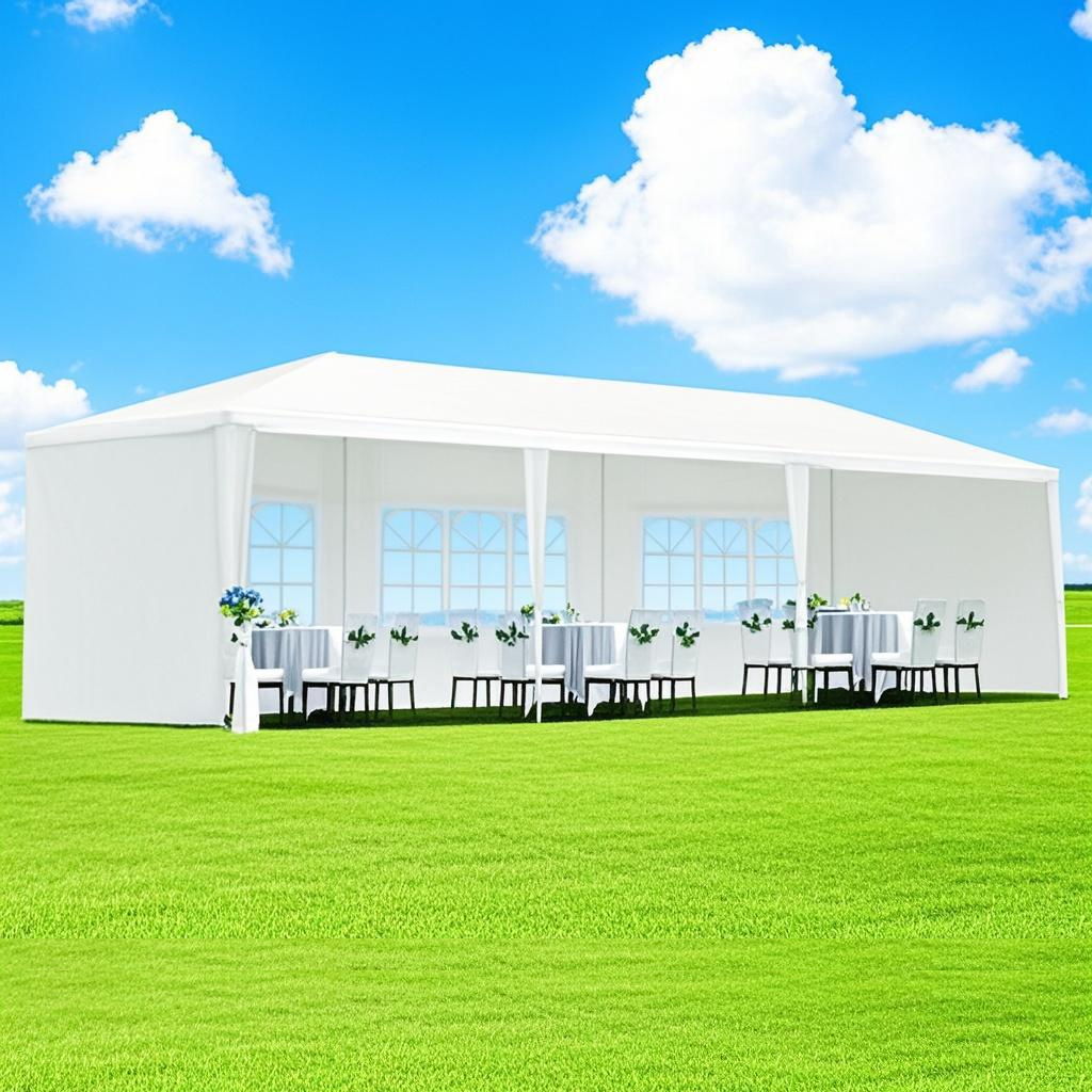 A 10X20' Outdoor Garden Gazebo Wedding Party Tent Canopy Marquee with removable sidewalls is set up on a green lawn under a blue sky, featuring tables with white cloths, black chairs, and flower centerpieces inside.
