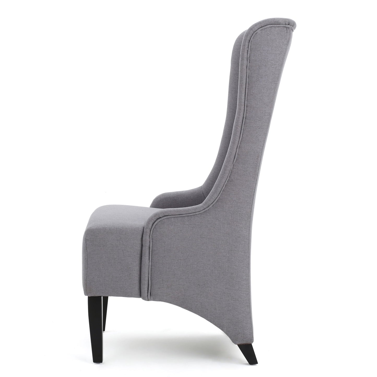 Side view of the Alight Upholstered Dining Chair, featuring a high back, gray fabric, curved cushioned backrest, and sleek birch wood legs; sold as a set of 2 for modern dining spaces.