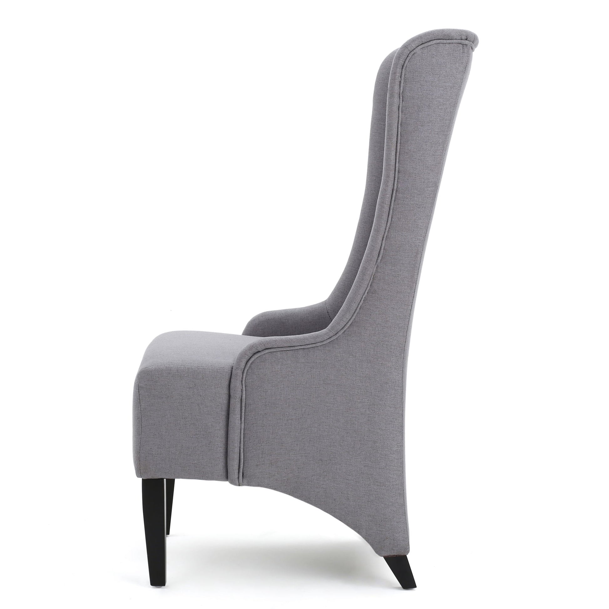 Side view of the Alight Upholstered Dining Chair, featuring a high back, gray fabric, curved cushioned backrest, and sleek birch wood legs; sold as a set of 2 for modern dining spaces.
