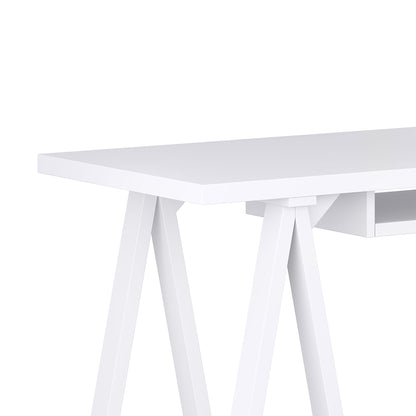 A close-up of the Sawhorse - Handcrafted Desk shows its modern white finish, flat rectangular top, sawhorse-style legs, minimalistic design with clean lines, and a small shelf beneath the desktop.