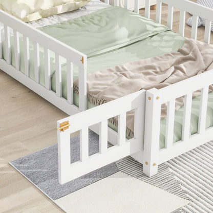 The House-Shaped Headboard Floor Bed With Fence, featuring safety rails and gold hardware, is styled with pastel green bedding and placed on a light wood floor beside a soft gray and cream textured area rug.