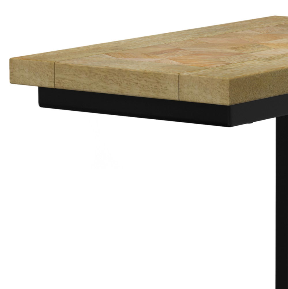 A close-up of the Skyler - Handcrafted C Side Table shows its light natural wood finish and sturdy black metal support underneath.