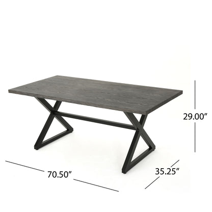 The Rolando Outdoor Aluminum Dining Table features a rectangular dark wood top and X-shaped black steel legs. Dimensions: 70.5" L x 35.25" W x 29" H. Presented against a white background.