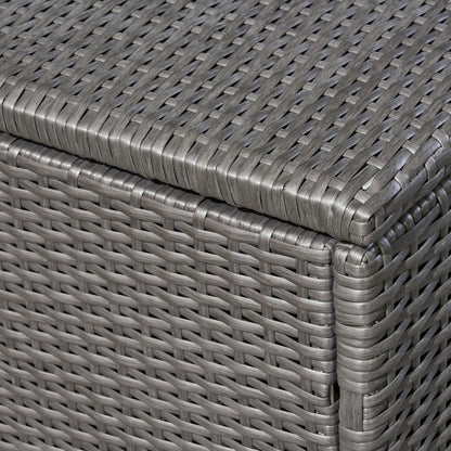 Close-up of the corner of the Santa Rosa - Storage Table, highlighting its gray woven rattan design with detailed interlaced pattern and smooth, rounded edges.