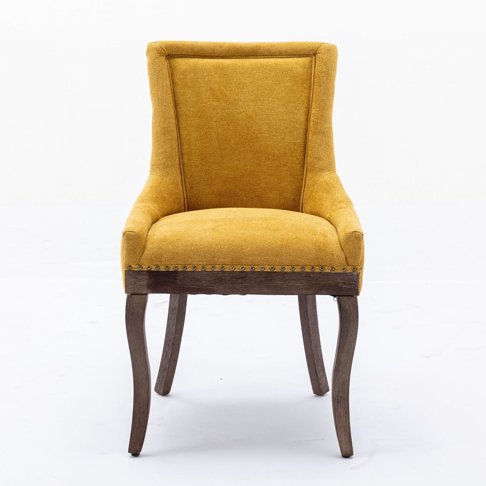 A set of two Ultra Side Dining Chairs with thickened fabric in mustard yellow, neutrally toned solid wood legs, and bronze nail head trim along the bottom edge, shown against a plain white background.
