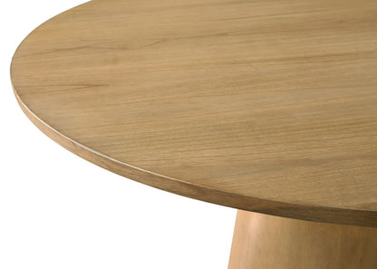 Close-up of the Jasper Wide Contemporary Round Dining Table, featuring a smooth light brown surface and part of its cylindrical base, paired with fabric chairs.