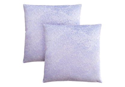 Two square decorative throw pillows with inserts, hypoallergenic and modern, featuring a light purple textured design with a subtle swirl pattern. Pillows are arranged overlapping on a white background.