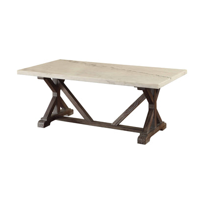 The Romina Marble Top Weathered Coffee Table features a sturdy dark wooden trestle base with angled supports and a rectangular white marble top.