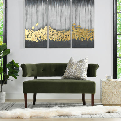 A modern living room with the Jared - Versatile Roll Arm Tufted Bench Settee in green velvet, a patterned throw pillow, abstract gold and gray triptych wall art, large windows, a potted plant, and a light rug topped with a fur accent.
