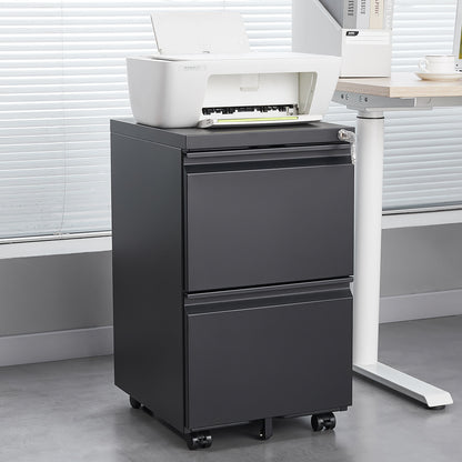 A white printer rests on a 2 Drawer File Cabinet With Lock, a metal under desk rolling filing cabinet for letter/legal/A4 size, next to a desk in a modern office with large window blinds.