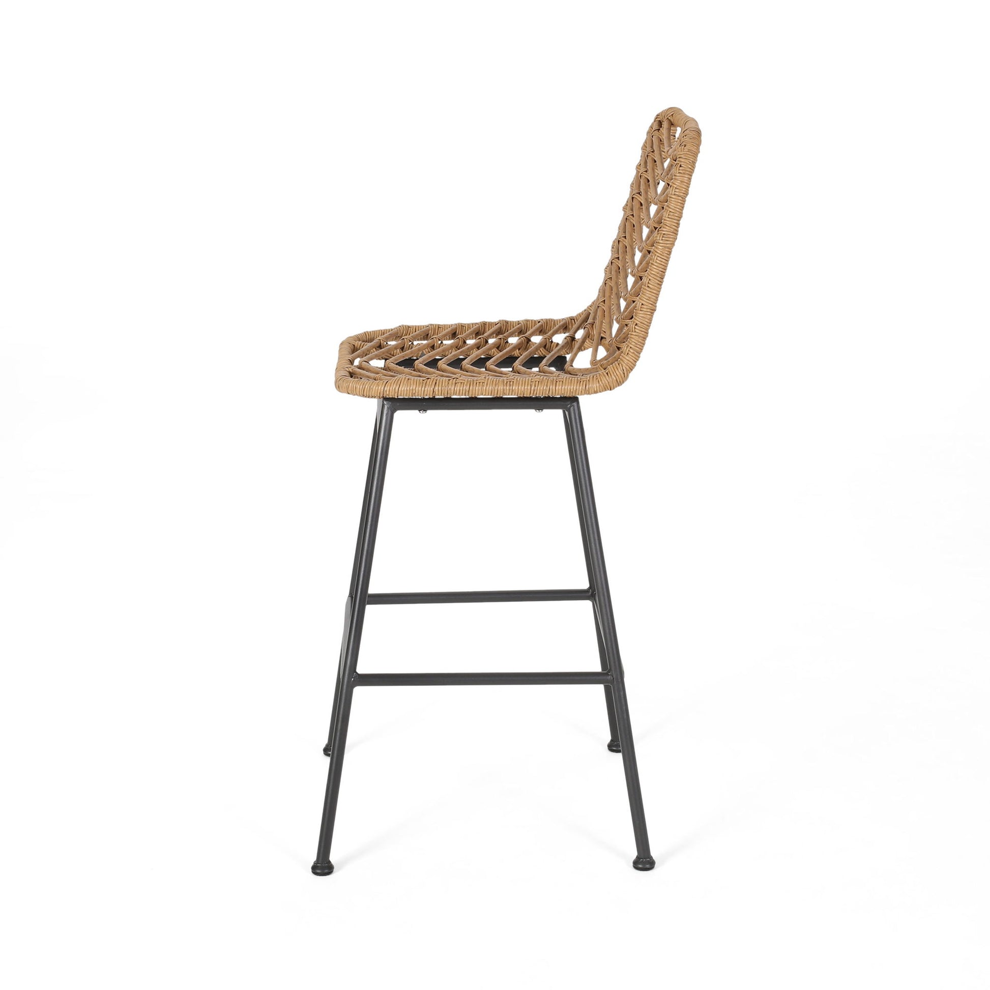 Side view of the Sawtelle Outdoor Wicker Barstool, featuring a woven rattan seat and backrest, supported by four black metal legs with footrests; shown on a plain white background. Set of 2.