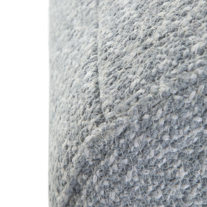 Close-up of the Bayley Versatile Round Braided Pouf’s textured grey woven fabric, showcasing visible stitches and a diagonal seam.
