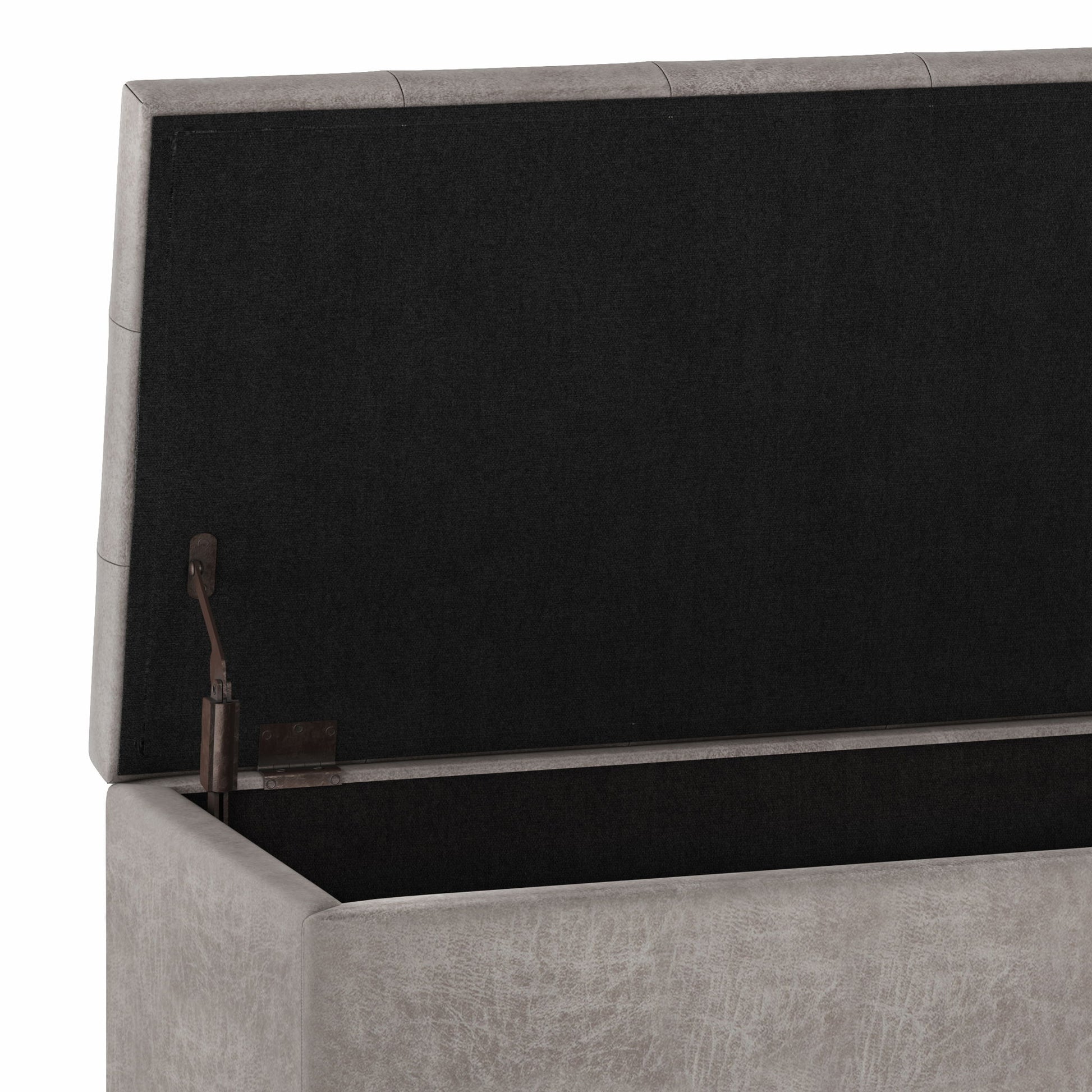The Cosmopolitan Upholstered Storage Ottoman features a gray fabric, an open lid revealing a spacious black interior, and a left-side hinge mechanism.