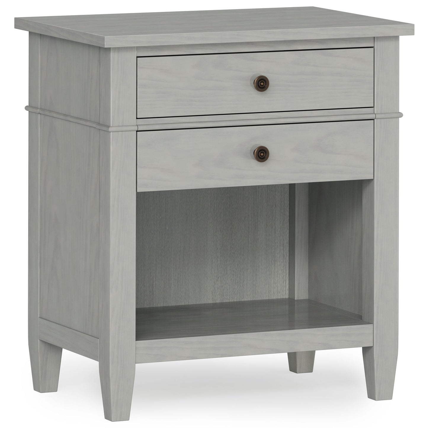 The Carlton Bedside Table is a handcrafted, light gray wooden nightstand with two drawers featuring round metal knobs, an open lower shelf, and simple tapered legs for a modern, minimalist look.