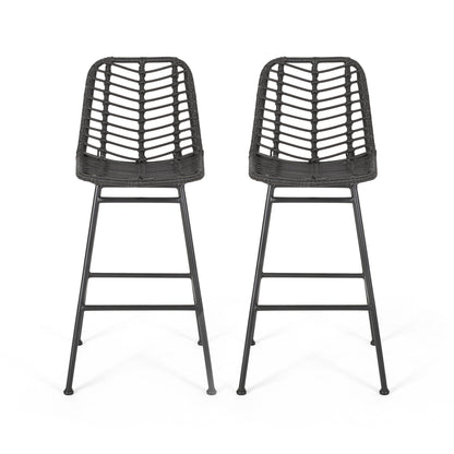 The Sawtelle Outdoor Wicker Barstools (Set of 2) feature modern black frames, woven rattan seats and backs with open geometric patterns, and slender metal legs. The barstools are shown side by side on a white background.