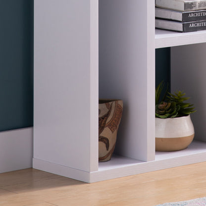 A close-up of the Versatile Display Cabinet with a brown-patterned vase and a potted green succulent on a wooden floor, set against a teal wall.