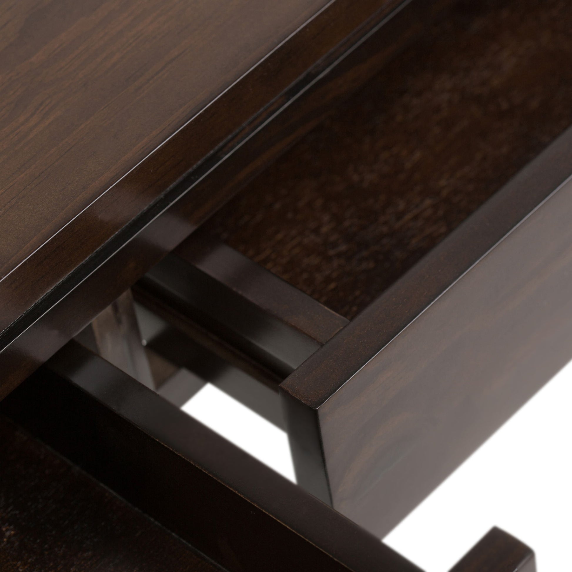 Close-up of partially open drawers on the Cosmopolitan Multipurpose Table, highlighting the smooth dark wood finish, clean lines, and visible interiors that showcase its craftsmanship and quality materials.