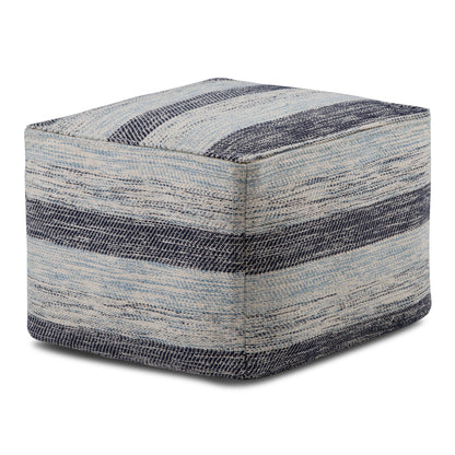 The Clay - Square Pouf, Upholstered is a fabric ottoman with a textured pattern of blue and gray horizontal stripes, featuring a soft woven look and a simple modern design.