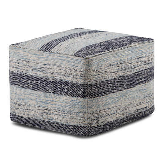 The Clay - Square Pouf, Upholstered is a fabric ottoman with a textured pattern of blue and gray horizontal stripes, featuring a soft woven look and a simple modern design.