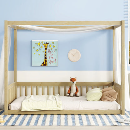 A cozy kids' room with a Canopy Frame Floor Bed With Fence, plush fox toy, round pillows, striped blue rug, giraffe "Reach for the Stars!" art print on the wall, and a round beige clock.