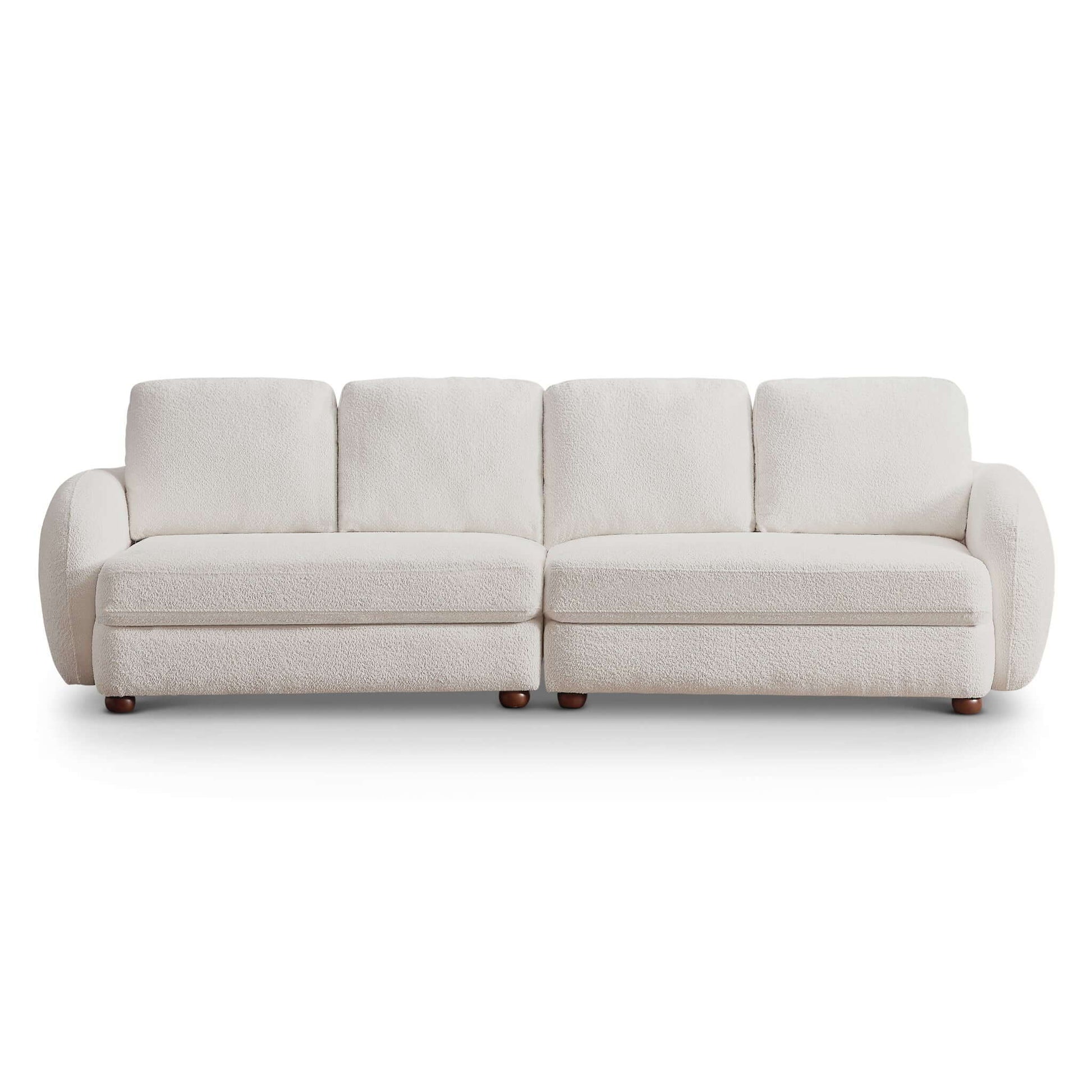 The Paton - Comfortable Sofa is a modern three-seater with plush white upholstery, rounded armrests, and short wooden legs, displayed against a white background.