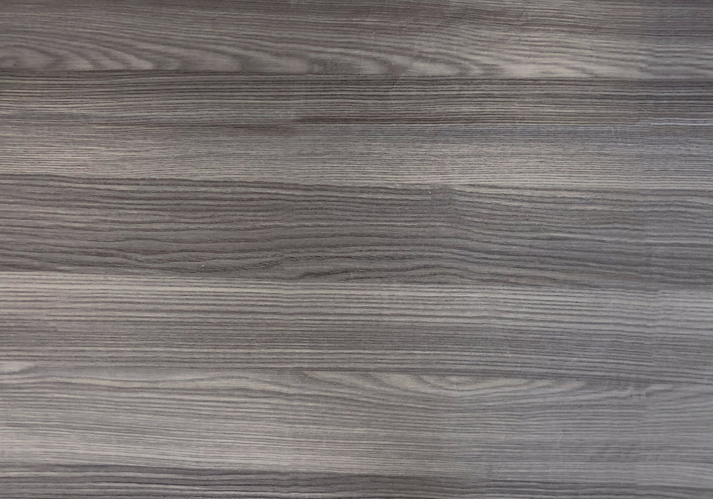 Close-up of the Accent Table's gray wooden surface features visible horizontal grain patterns, elegant design details, and subtle texture variations that highlight the transitional style of this side table.
