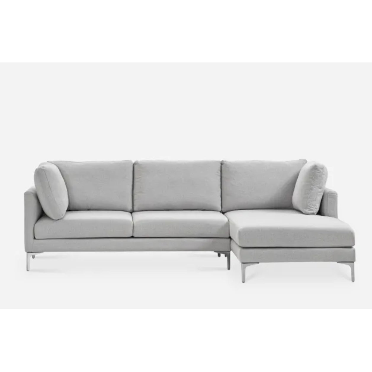 A modern gray sectional sofa with an L-shaped design. It features three seat cushions, two back cushions, and additional side cushions. The sofa has sleek metal legs and a minimalist style, set against a plain white background.
