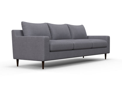 The Alex Sofa is a contemporary piece with clean lines, featuring a minimalist design in gray and three cushions. Its sleek and stylish appearance is enhanced by tapered dark wooden legs.