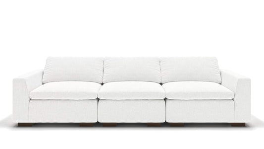 A sleek, minimalist 106" Like Butter sofa in luxurious Enzo/Cream leather, featuring plush cushions and blocky wooden legs, set against a plain white background.
