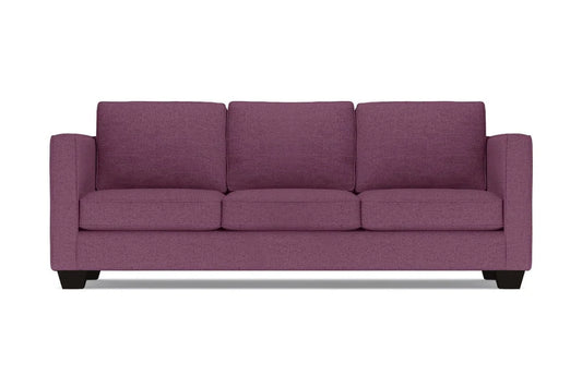 The Catalina Sofa is a three-seater in purple, featuring square arms and a modern design with three cushions and a low profile. It is displayed against a plain white background.