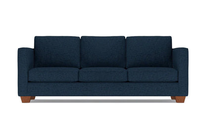 The Catalina Sofa, featuring a dark blue color, is a three-seater with square armrests and wooden legs, shown from the front against a white background.