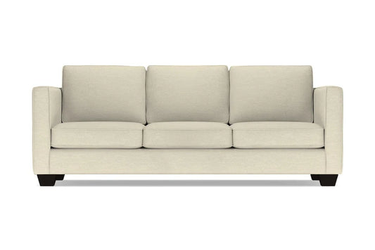 Introducing the Catalina Sofa: a three-seater in beige with square cushions and armrests, featuring black wooden legs, elegantly showcased against a white background.