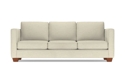The Catalina Sofa is a beige three-seater featuring square cushions and wooden legs. It showcases a modern, minimalist design and is displayed against a plain white background.