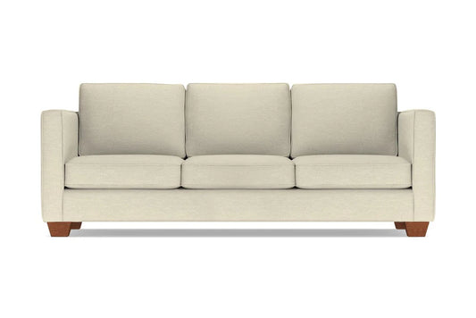 The Catalina Sofa is a beige three-seater featuring square cushions and wooden legs. It showcases a modern, minimalist design and is displayed against a plain white background.