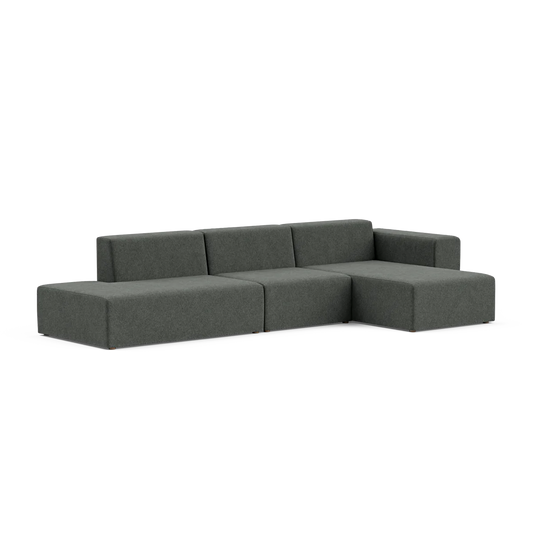 Presenting the Three-Seater Form Sectional: a contemporary L-shaped gray sofa with sleek lines and a minimalist design, featuring wide cushions and low backrests, elegantly showcased against a white backdrop.