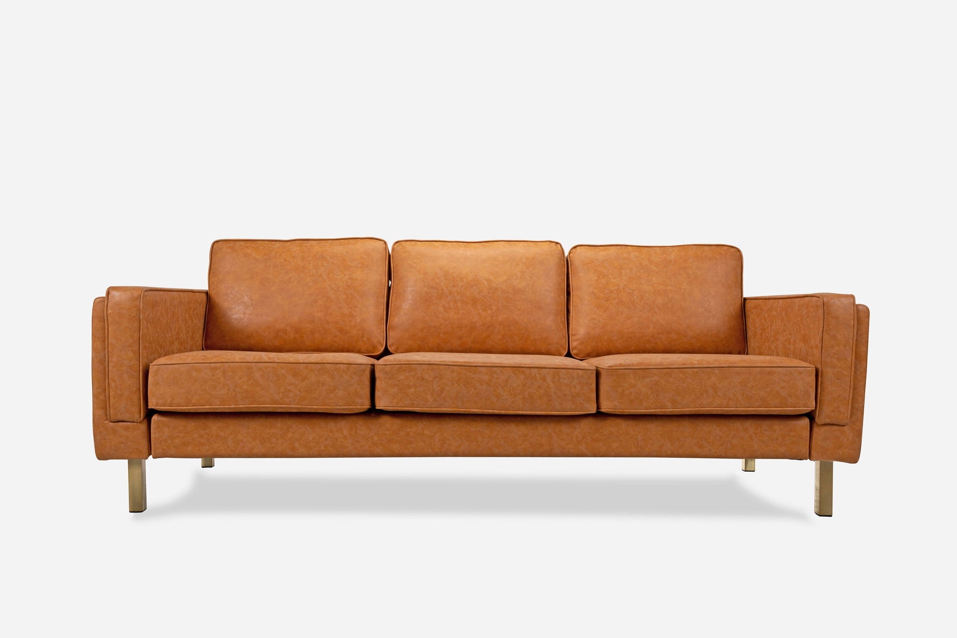 The Albany Sofa is a modern three-seater with sleek lines, light brown leather upholstery, three seat and back cushions, and slender wooden legs, shown against a plain white background.
