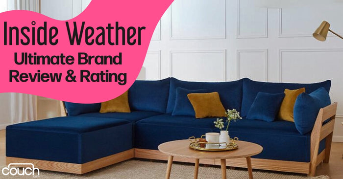 A modern living room with a blue sectional sofa and mustard yellow pillows. A round wooden coffee table with decorative items is in front. Text overlay: "Inside Weather: Ultimate Brand Review & Rating.