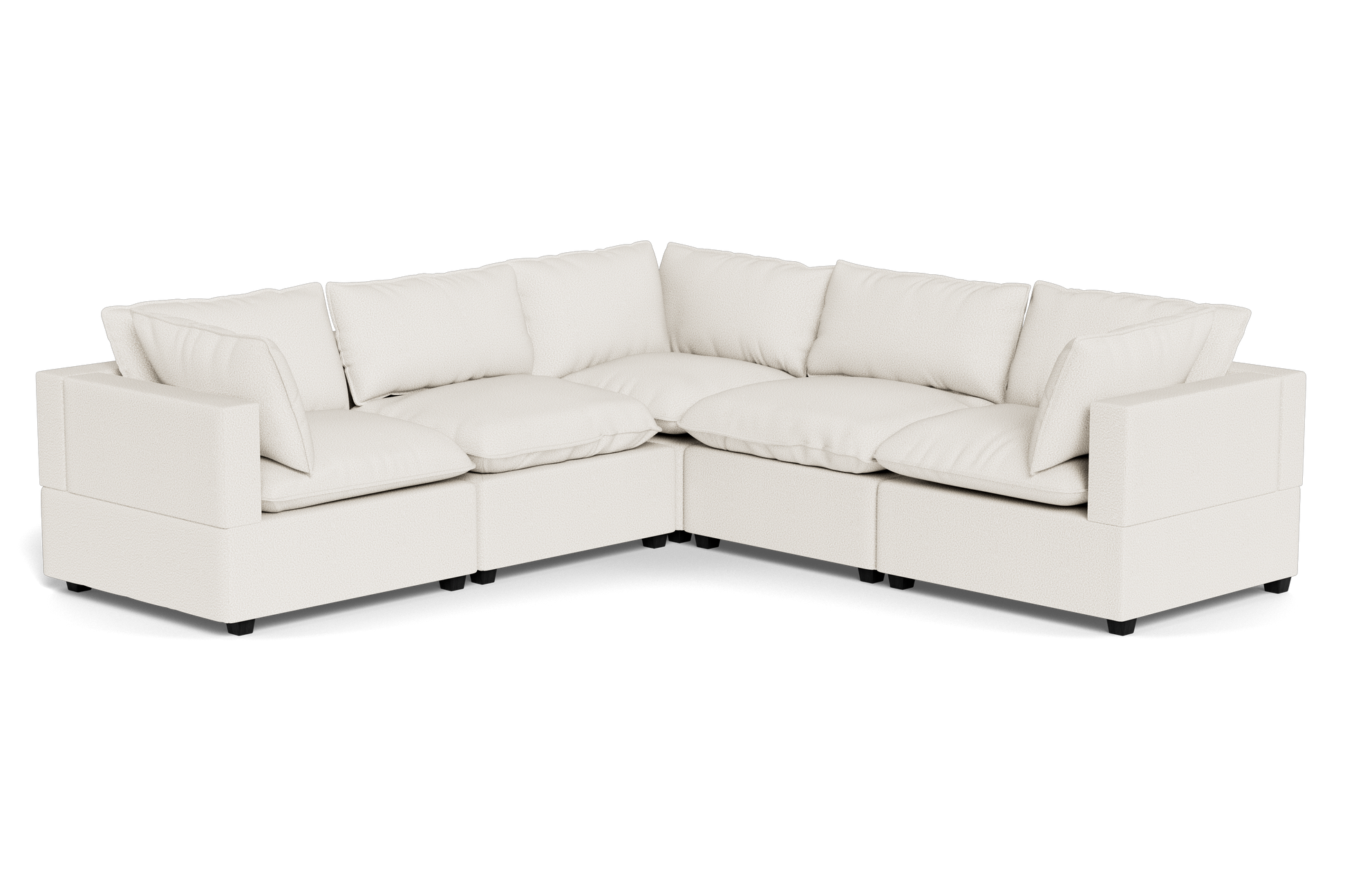 The Kova Pillow Cushion Corner Sectional is a spacious L-shaped sofa featuring cream upholstery and plush back and seat cushions.