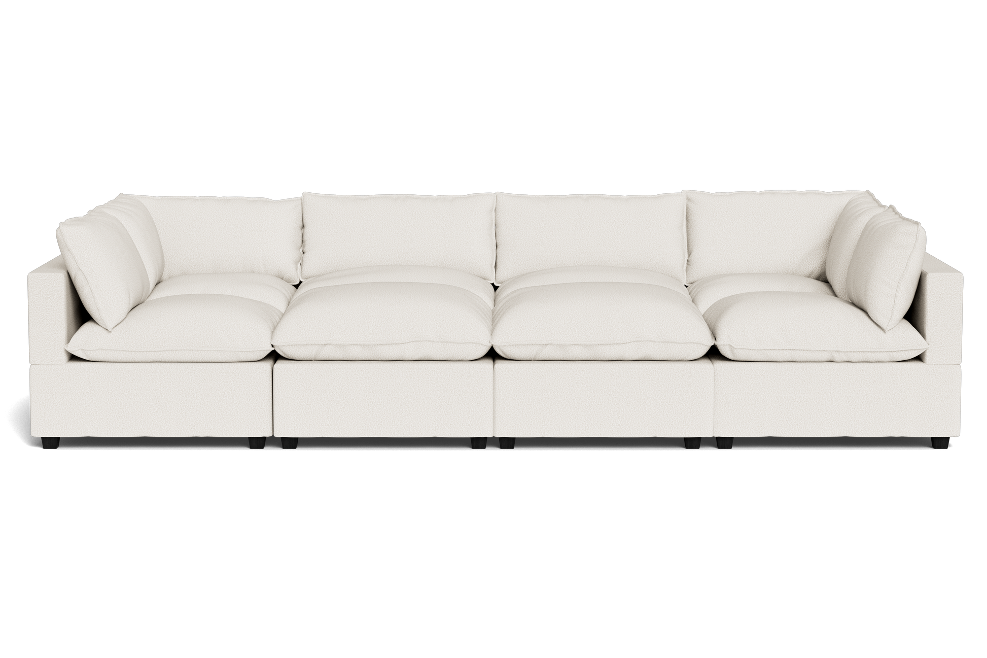 The Kova Pillow Cushion Grand Pit is a modern, large white sectional sofa featuring six seat cushions and six matching back pillows, shown from the front against a plain black background.