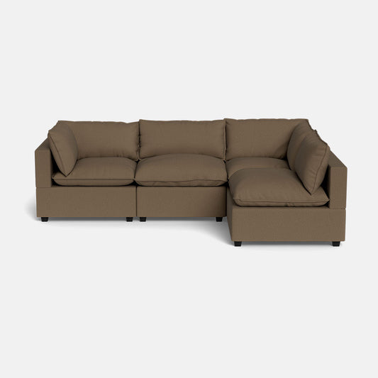 The Kova Pillow Cushion L-Shape sectional, featuring three seat cushions and back pillows in brown, is displayed against a plain white background.