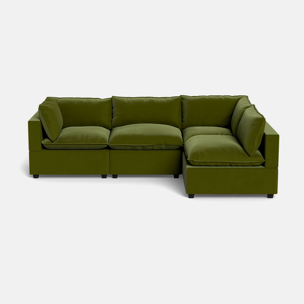 The Kova Pillow Cushion L-Shape is a modern olive green sectional sofa with plush cushions and a right-hand chaise, set against a plain white background.