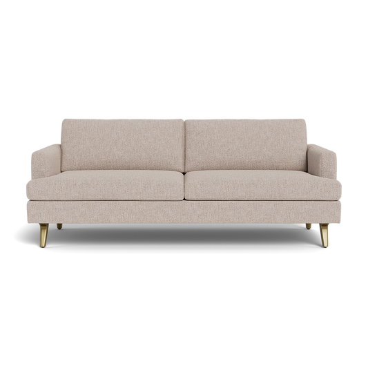 The Lido Sofa 75" is a modern beige fabric sofa featuring two seat and back cushions, low arms, and four gold metal legs, displayed against a black background.