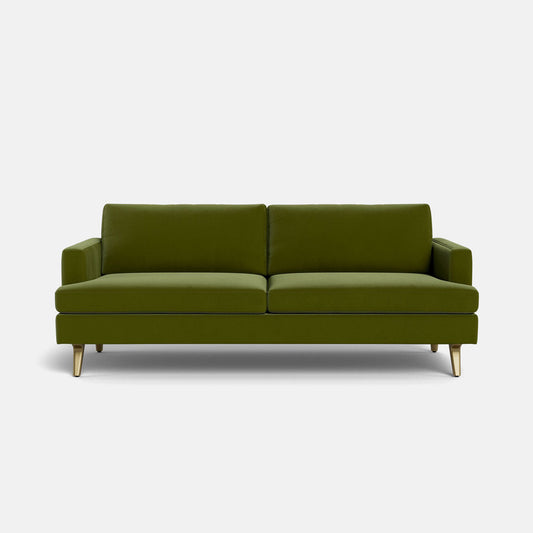 The Lido Sofa 75" is a modern green sofa with clean lines, two seat cushions, and angled wooden legs, displayed against a plain white background.