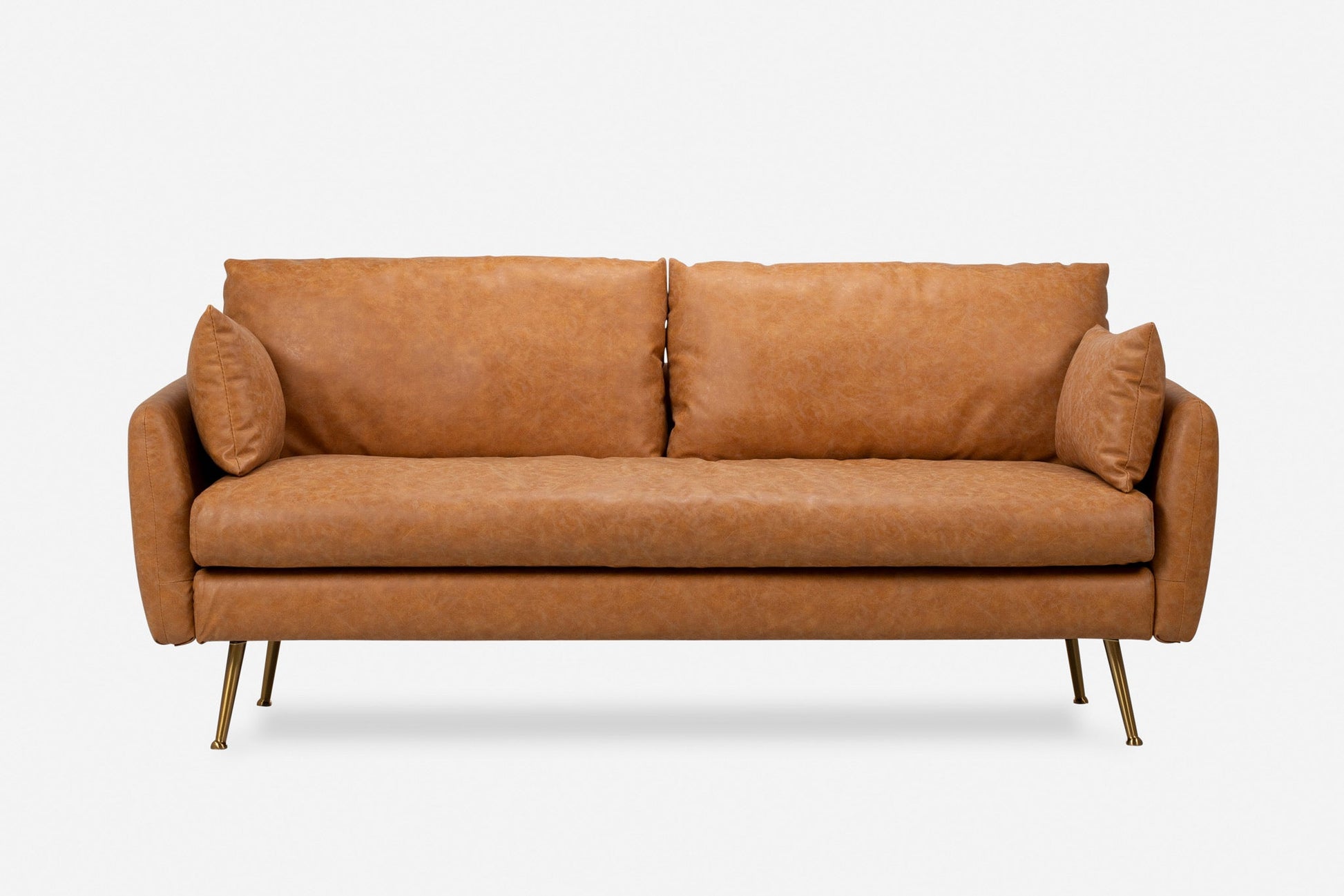 The Park Sofa is a modern tan leather sofa featuring two seat and back cushions, two matching side pillows, slim arms, and four slender gold-colored metal legs, shown against a plain white background.