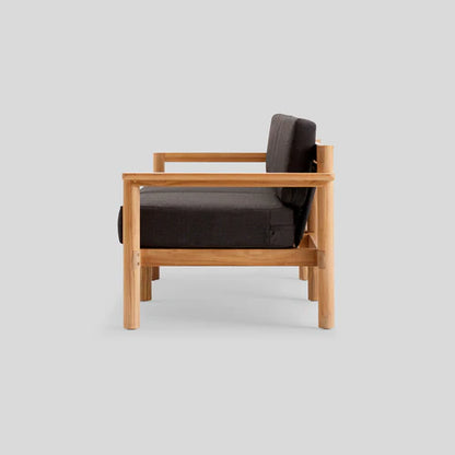 Side view of the Haven Sofa featuring a natural wood frame and dark cushioned seat and backrest, set against a light gray background.