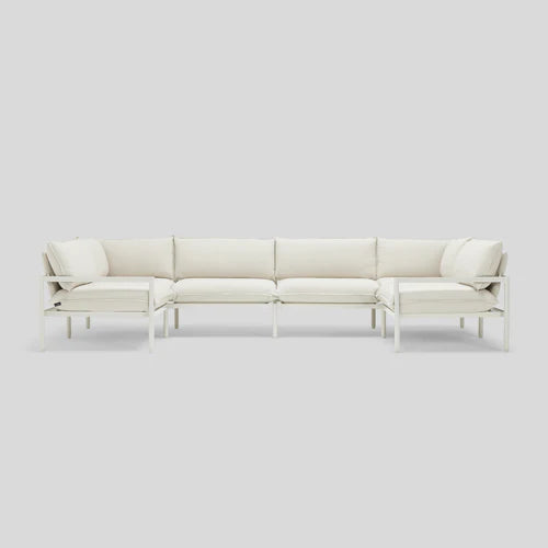 The Terra Sectional is a white, modern sofa with a metal frame and cushioned seats, organized in an L-shape on a light gray background.