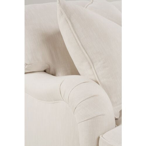 Close-up of the Brooke 6-Piece Left-Facing Sectional in beige upholstery, featuring plush cushions and rounded armrests that highlight the texture and comfort of the fabric.