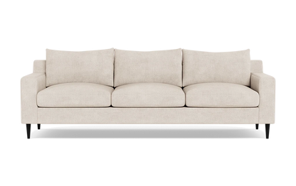 The Sloan Custom 3-Seat 95" Sofa features a beige upholstery with smooth finish, complemented by three plush and comfortable cushions. It has straight armrests and stands on four dark legs, all set against a white background.